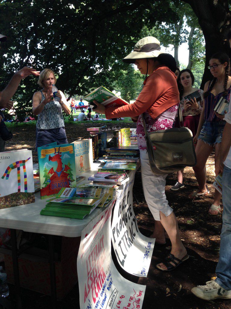 Handing out books to passersby. Credit: Melissa Rosati