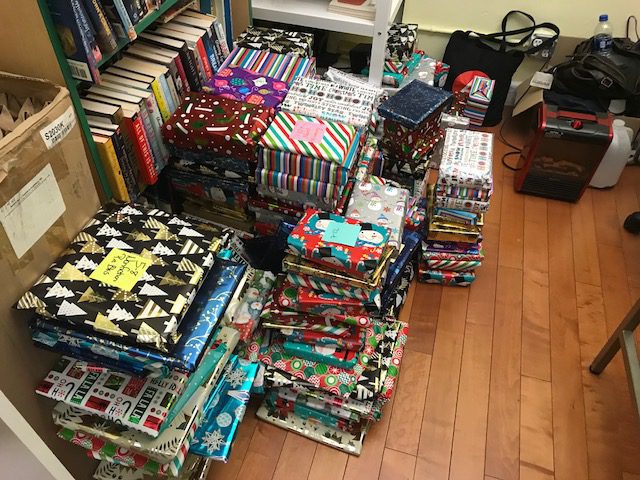 Books collected and wrapped during the 2018 Holiday Book Drive